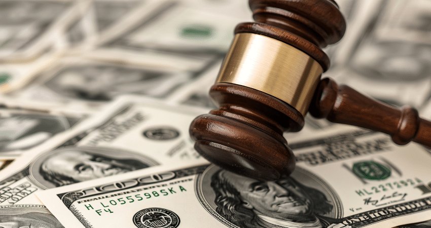 gavel on hundred dollar bills