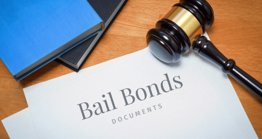 bail bonds documents book and gavel on table