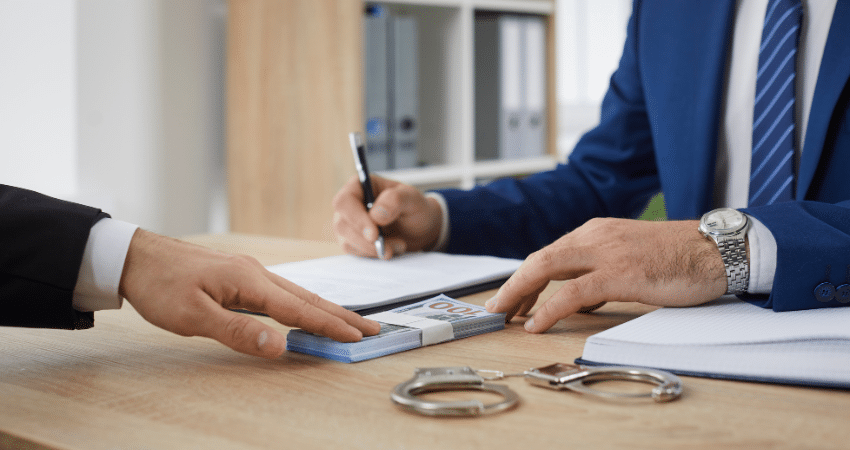 man giving money to trusted local bail bond company