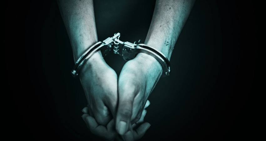 hands together in handcuffs